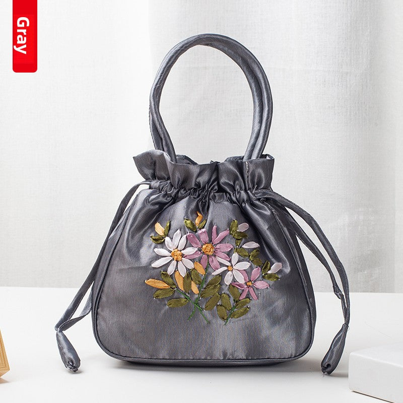 Hand-Embroidered Floral Drawstring Clutch Bag